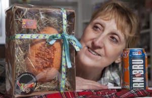 Patricia Galfskiy who owns Chillilicious, with the Irn Bru with Bacon Chilli Chocolate Easter Eggs. Picture: SWNS