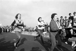 Women taking part in the traditional Shrove Tuesday pancake race along Portobello promenade in February 1982.