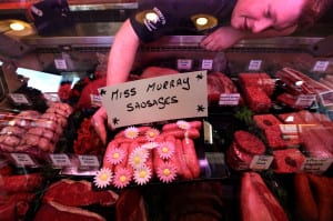 Butcher Connor Wilson from David Bennett and Son with his "Miss Murray Sausages" in Andy Murray's home town of Dunblane. Picture: PA