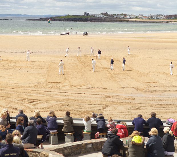 The Ship Inn's cricket team play on the beach outside the pub