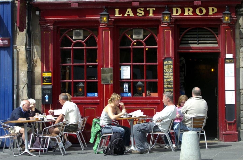 The Last Drop pub in the Grassmarket. Drinkers enjoy a drink outside The Last Drop. People Drinking