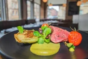Pure-bred angus rump steak, grilled gem lettuce and smoked tomato. Picture: O & F