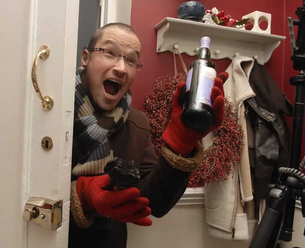 First Footing - A guest bearing gift arrives on New Year's Day. Picture: TSPL