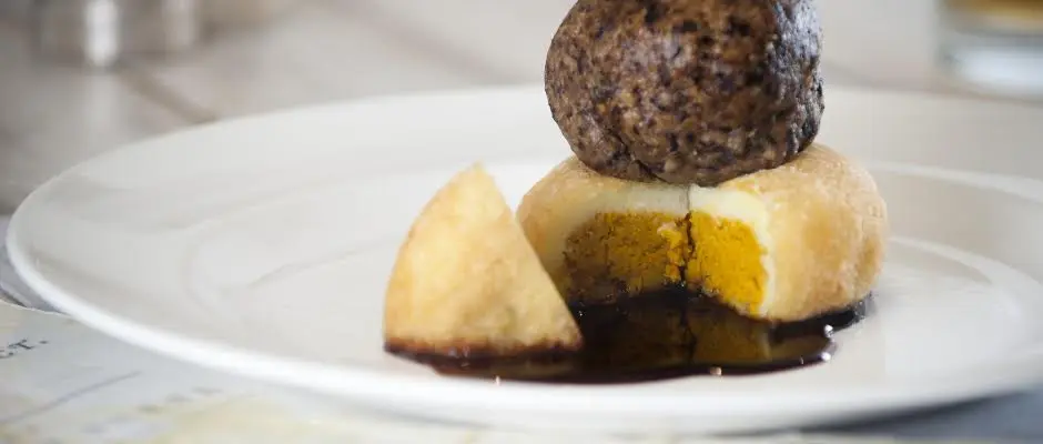 Haggis with a neeps and tattie tikki Photography of Tony Singh's Burns menu