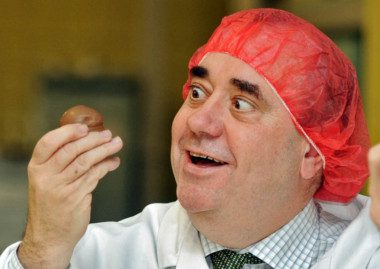 The First Minister admires a Tunnock's teacake for a photshoot at the Uddingston factory. Picture: Phil Wilkinson