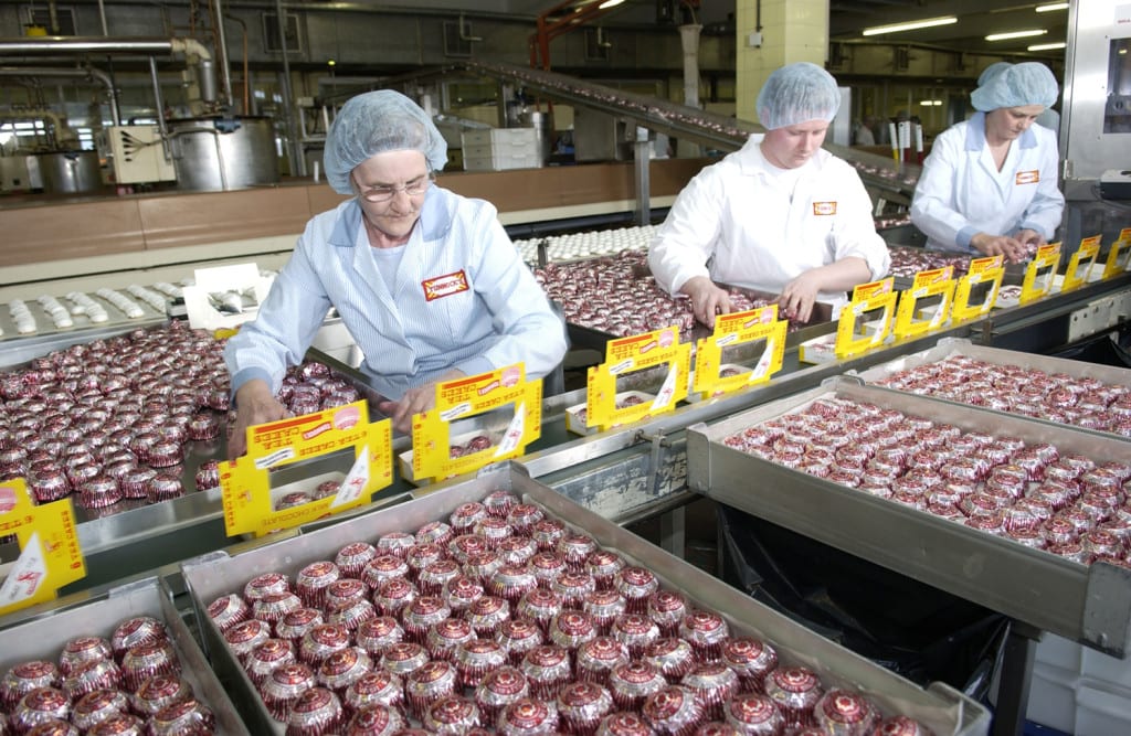 Workers pack Teacakes at the Tunnock's factory. Picture: Robert Perry 