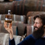 Scottish company achieves world first with unique gin blend featuring gin aged in oak barrels for 10 years